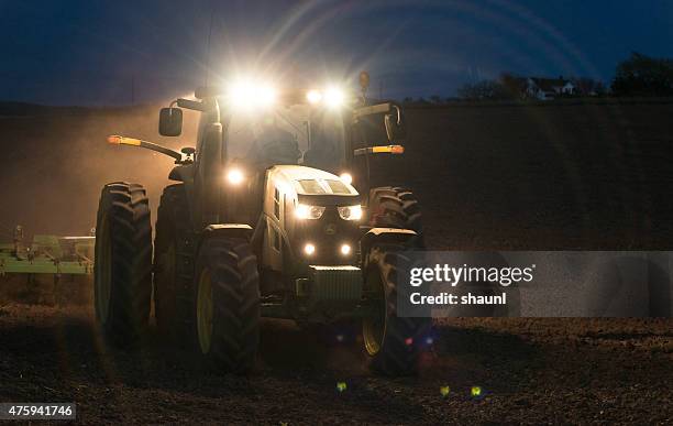 farmer working late - john deere bildbanksfoton och bilder