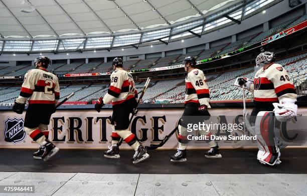 Jared Cowen, Matt Kassian, Patrick Wiercioch, and goaltender Robin Lehner of the Ottawa Senators walk out for practice as part of the 2014 Tim...