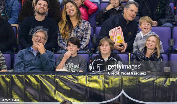 Harrison Ford, Liam Flockhart and Calista Flockhart attend a hockey game between the Carolina Hurricanes and the Los Angeles Kings at Staples Center...