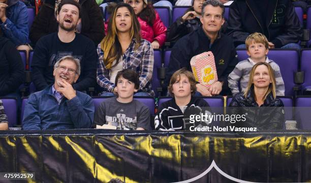 Harrison Ford, Liam Flockhart and Calista Flockhart attend a hockey game between the Carolina Hurricanes and the Los Angeles Kings at Staples Center...