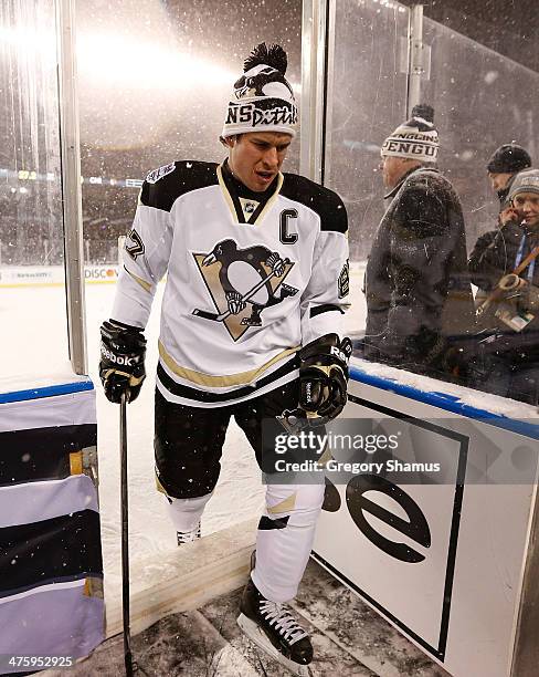 Sidney Crosby of the Pittsburgh Penguins steps off the ice after warmups prior to the 2014 NHL Stadium Series game against the Chicago Blackhawks on...