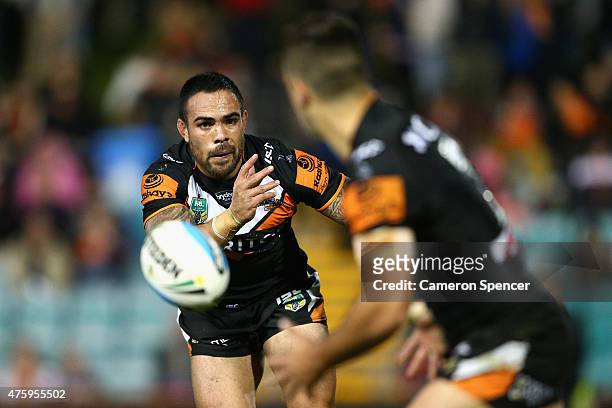 Dene Halatau of the Tigers passes during the round 13 NRL match between the Wests Tigers and the Gold Coast Titans at Leichhardt Oval on June 5, 2015...