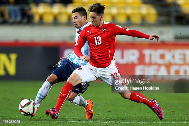 Leonardo Rolon of Argentina is tackled by Michael Brandner of Austria during the FIFA U-20 World Cup New Zealand 2015 Group B match between Austria...