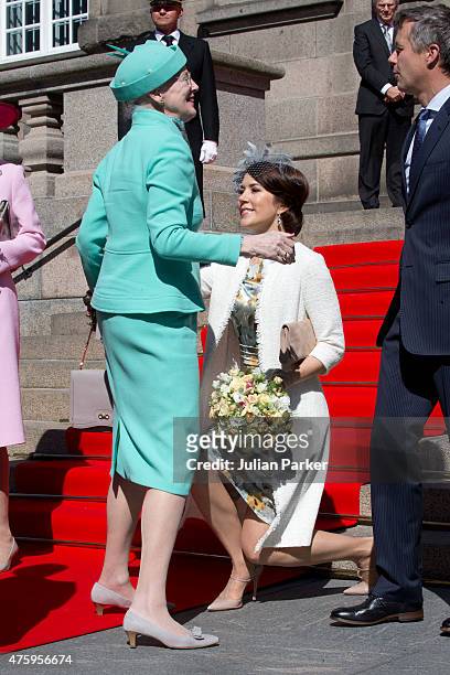 Queen Margrethe of Denmark and Crown Princess Mary of Denmark greet at Christiansborg Palace on the occasion of The 100th Anniversary Of The 1915...