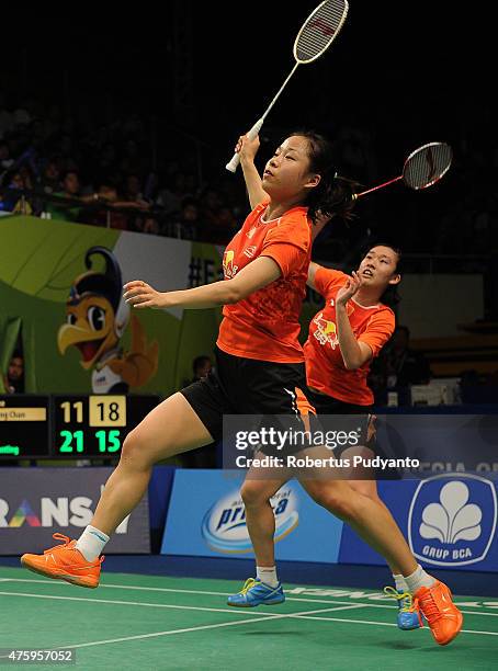 Ma Jin and Tang Yuanting of China returns a shot against Lee So Hee and Shin Seung Chan of Korea during the 2015 BCA Indonesia Open Quarterfinals...