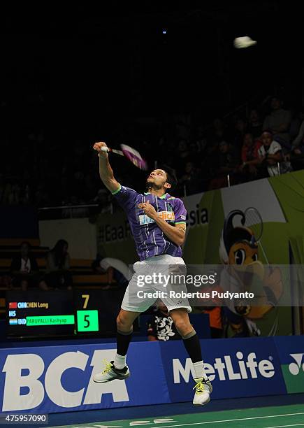 Parupalli Kashyap of India returns a shot against Chen Long of China during the 2015 BCA Indonesia Open Quarterfinals match at Istora Senayan on June...