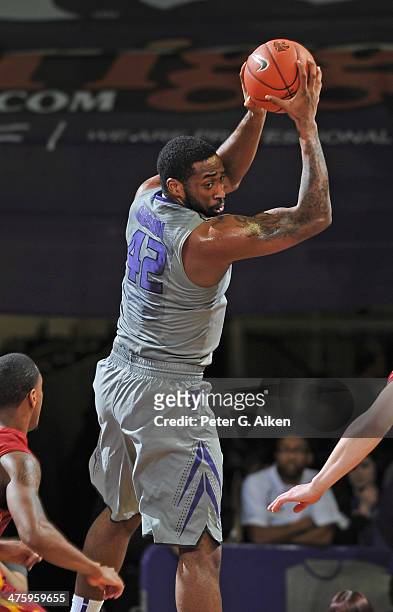 Forward Thomas Gipson of the Kansas State Wildcats pulls down a rebound against the Iowa State Cyclones during the first half on March 1, 2014 at...