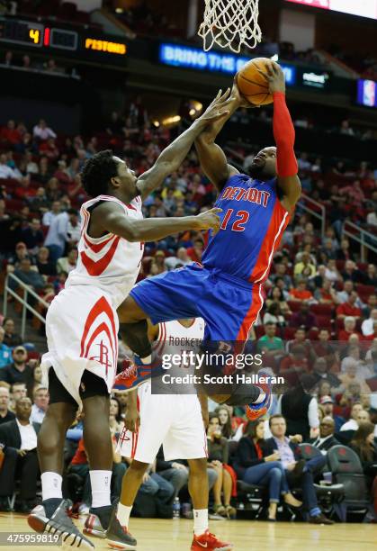 Will Bynum of the Detroit Pistons shoots against Patrick Beverley of the Houston Rockets during the game at the Toyota Center on March 1, 2014 in...