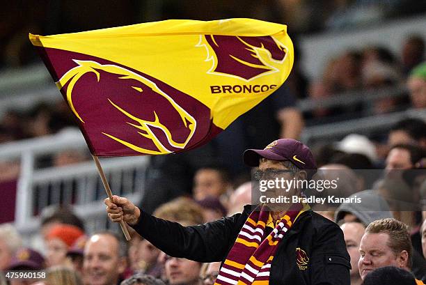 Broncos fan waves their flag during the round 13 NRL match between the Brisbane Broncos and the Manly Sea Eagles at Suncorp Stadium on June 5, 2015...