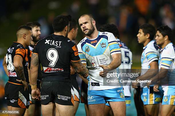 Dene Halatau of the Tigers and Nate Myles of the Titans shake hands following the round 13 NRL match between the Wests Tigers and the Gold Coast...