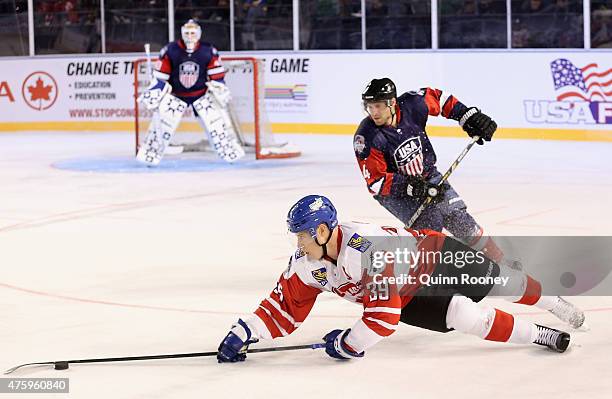 Frazer McLaren of Canada dives for the puck during the 2015 Ice Hockey Classic match between the United States of America and Canada at Rod Laver...