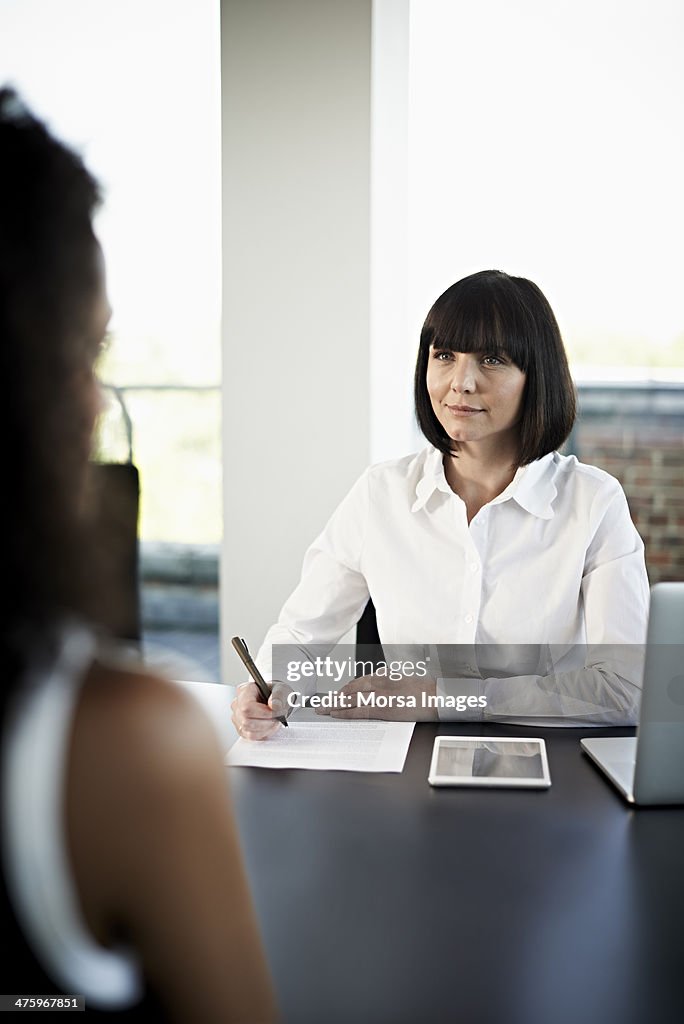 Businesswoman interviewing candidate