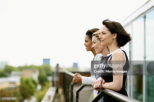 coworkers getting fresh air - sleeveless dress stock pictures, royalty-free photos & images