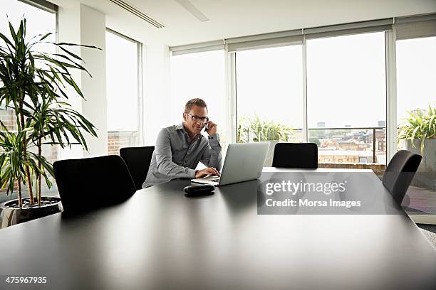 business man working in modern office - business man using phone stock pictures, royalty-free photos & images