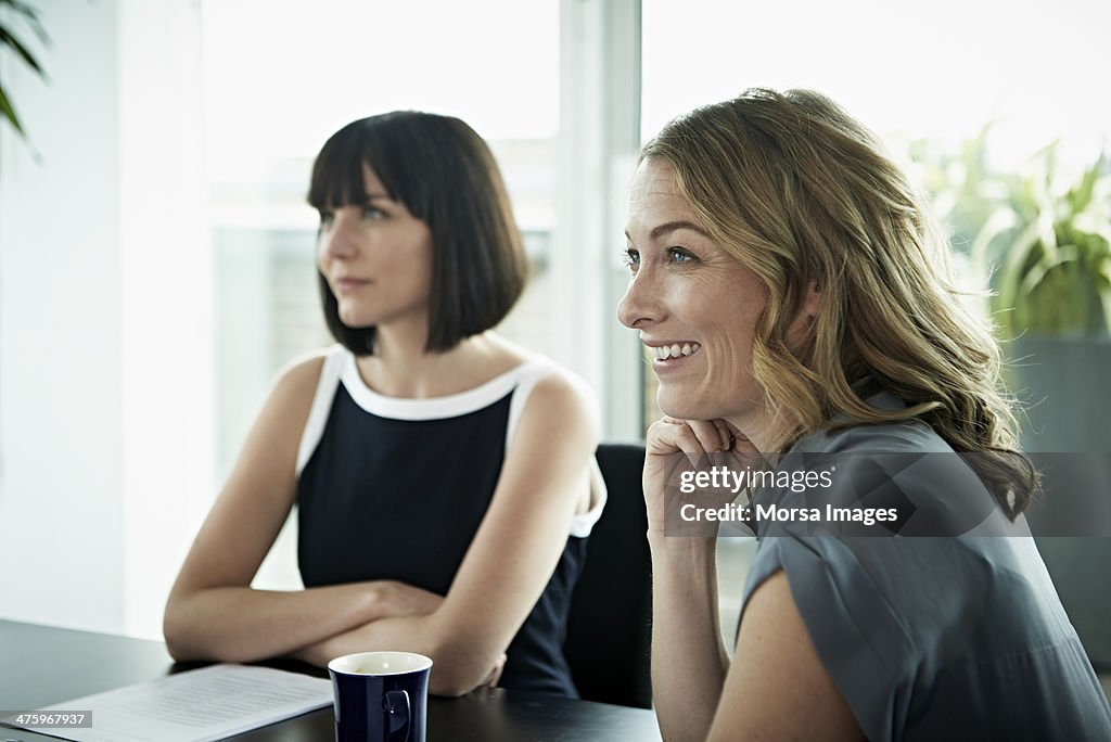 Smiling businesswomen in meeting
