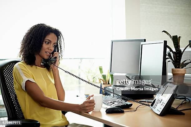 businesswoman talking over the phone - office telephone stock pictures, royalty-free photos & images