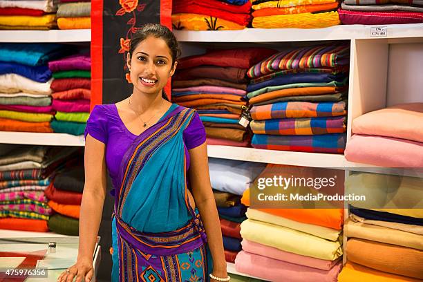 sri lankan woman in a sari as a shop assistant - south asia store owner stock pictures, royalty-free photos & images