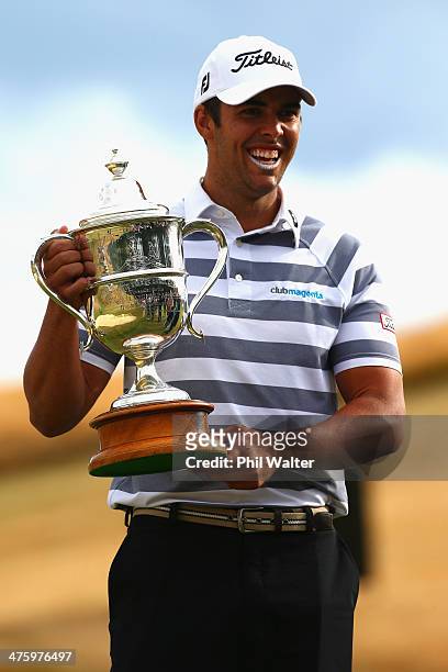 Dimitrios Papadatos of Australia holds the New Zealand Open trophy after winning the New Zealand Open at The Hills Golf Club on March 2, 2014 in...