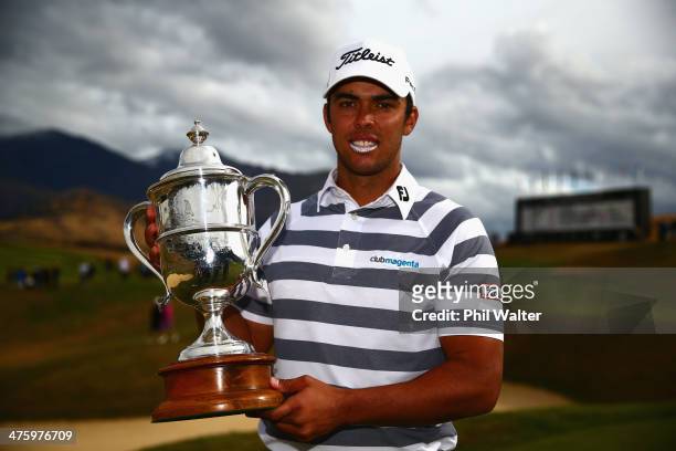 Dimitrios Papadatos of Australia holds the New Zealand Open trophy after winning the New Zealand Open at The Hills Golf Club on March 2, 2014 in...