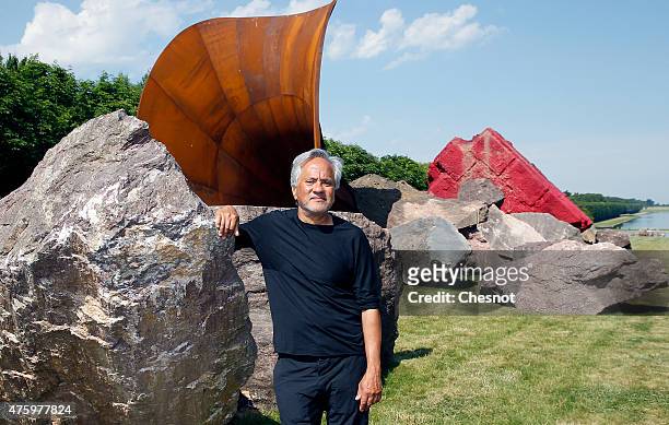 British contemporary artist of Indian origin Anish Kapoor poses in front of his artwork named 'Dirty Corner' at the opening of his exhibition of his...