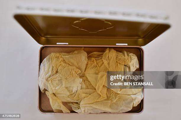 Boxed slice of wedding cake, from the British Royal wedding of Britain's Prince Charles, Prince of Wales and his second wife Britain's Camilla,...