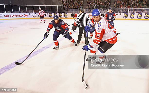 Frazer McLaren of Canada controls the puck during the 2015 Ice Hockey Classic match between the United States of America and Canada at Rod Laver...