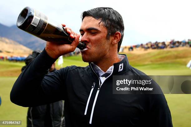 Dimitrios Papadatos of Australia celebrates with champagne after winning the New Zealand Open at The Hills Golf Club on March 2, 2014 in Queenstown,...