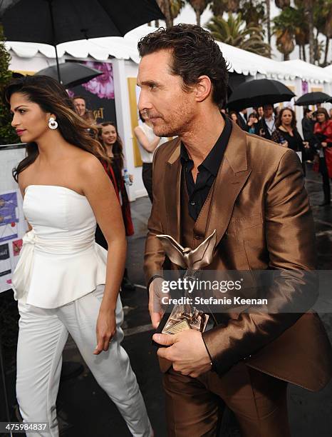 Actor Matthew McConaughey , wearing Piaget, and Camila Alves attend the Piaget Lounge during the 2014 Film Independent Spirit Awards at Santa Monica...