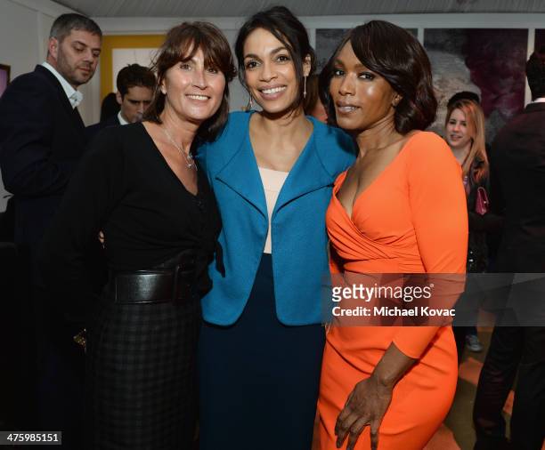 Manager of Piaget Natacha Hertz, actresses Rosario Dawson and Angela Bassett, both wearing Piaget, pose in the Piaget Lounge during the 2014 Film...