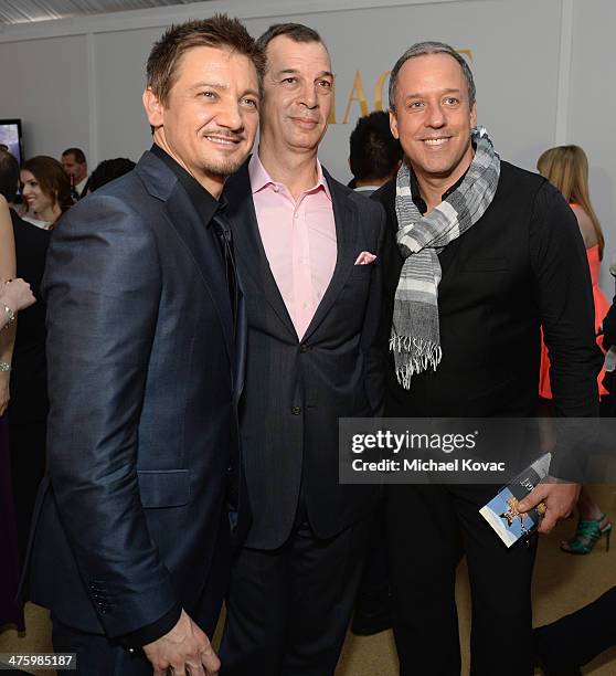 Actor Jeremy Renner, CEO of Piaget Philippe Leopold-Metzger and guest pose in the Piaget Lounge during the 2014 Film Independent Spirit Awards at...