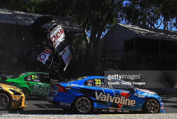 Jason Bright driving the Team BOC Holden is involved in a crash during race three of the V8 Supercars Championship Series at the Adelaide Street...