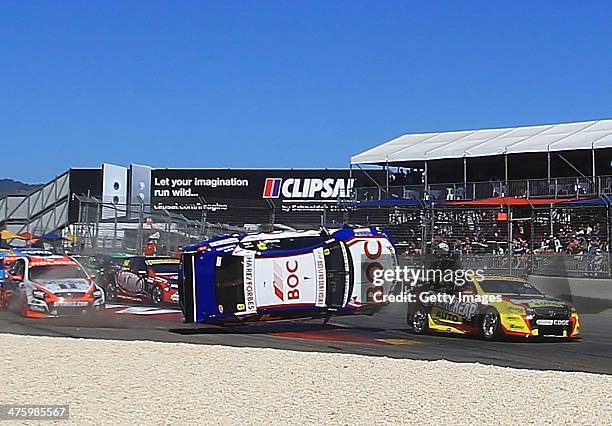 Jason Bright driving the Team BOC Holden is involved in a crash during race three of the V8 Supercars Championship Series at the Adelaide Street...