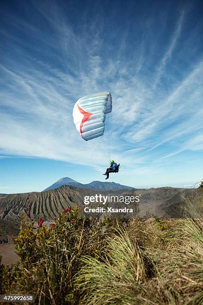 paragliding - mount bromo stock pictures, royalty-free photos & images