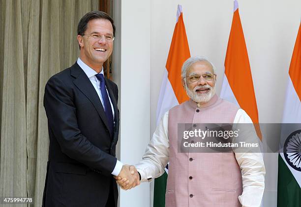 Prime Minister Narendra Modi shakes hands with his Netherland counterpart Mark Rutte before a meeting at Hyderabad House on June 5, 2015 in New...