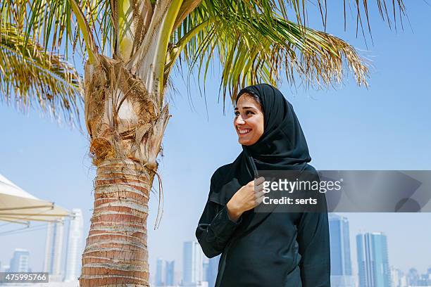 portrait of emirati woman smiling - emarati woman stock pictures, royalty-free photos & images