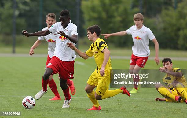 Idrissa Toure of Leipzig and Christian Pulisic of Dortmund fight for the ball during the B-Juniors Bundesliga Semi Final match between Borussia...