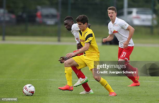 Christian Pulisic of Dortmund tackles Idrissa Toure of Leipzig during the B-Juniors Bundesliga Semi Final match between Borussia Dortmund and RB...