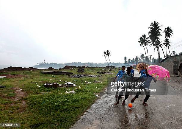 School children enjoys the arrival of Monsoon as Kerala witnessed monsoon rains on Friday, in Kovalam, India, on June 05, 2015. School reopening in...