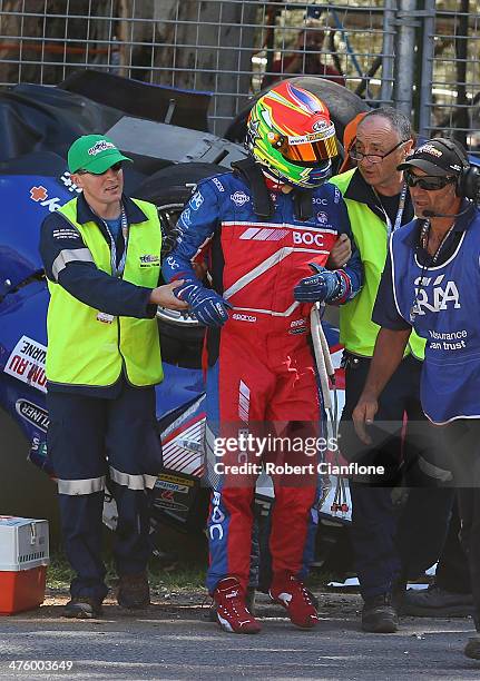 Jason Bright driver of the Team BOC Holden is removed from his car after he was involved in a rollover during race three of the V8 Supercars...
