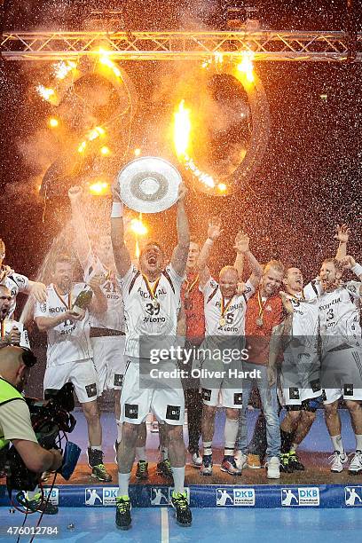 Filip Jicha of Kiel celebrate with the trophy wit his teamates after the DKB HBL Bundesliga match between THW Kiel and TBV Lemgo at Sparkassen Arena...