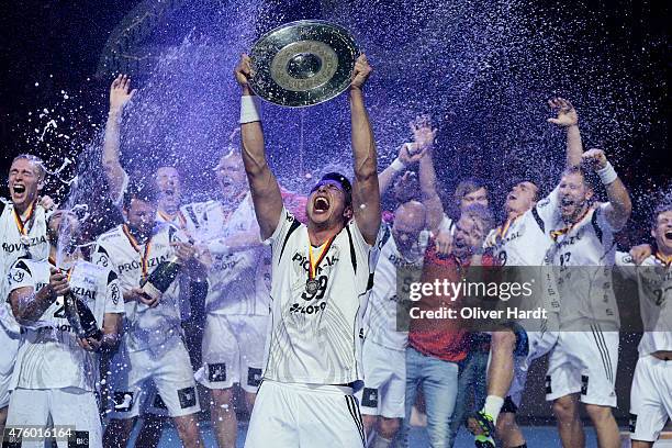 Filip Jicha of Kiel celebrate with the trophy wit his teamates after the DKB HBL Bundesliga match between THW Kiel and TBV Lemgo at Sparkassen Arena...