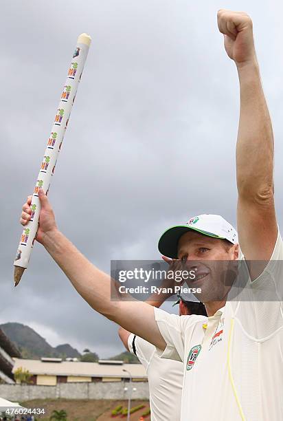 Adam Voges of Australia celebrates victory after day three of the First Test match between Australia and the West Indies at Windsor Park on June 5,...