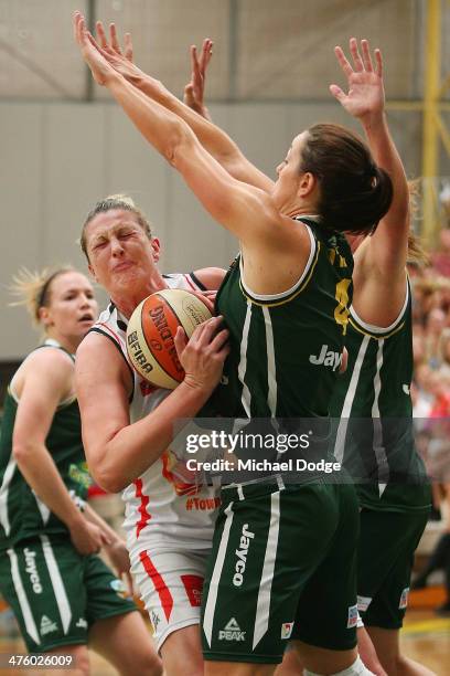 Jenna O'Hea of the Ranges blocks Suzy Batkovic of the Fire during the WNBL Preliminary Final match between the Dandenong Rangers and the Townsville...