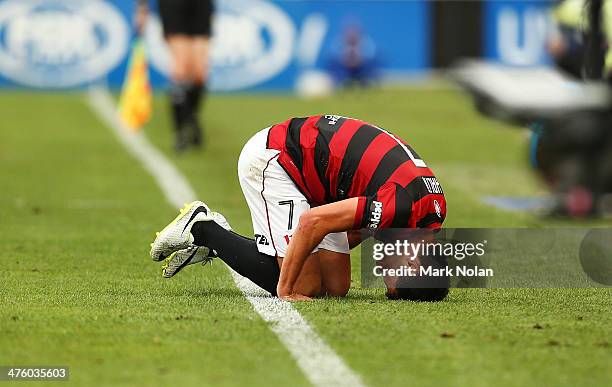 Labinot Haliti of the Wanderers collides with Joshua Brillante of the Jets and injures his ankle during the round 21 A-League match between the...