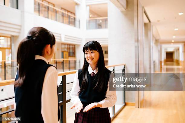 japanese high school. students chat, first floor corridor, overlooking atrium - assembly room stock pictures, royalty-free photos & images