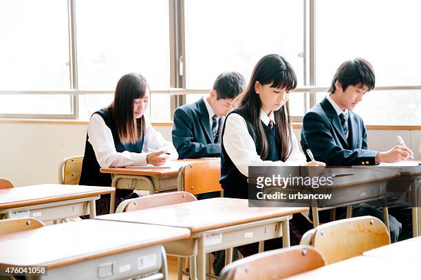 high school students, teenagers studying in a classroom, japan - japanese school uniform stock pictures, royalty-free photos & images