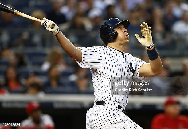 Mark Teixeira of the New York Yankees hits a two run home run in the third inning against the Los Angeles Angels of Anaheim during a MLB baseball...