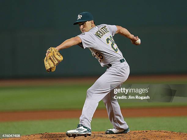 Pat Venditte of the Oakland Athletics throws in relief in the seventh inning against the Boston Red Sox at Fenway Park on June 5, 2015 in Boston,...