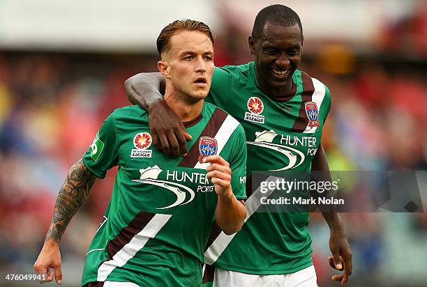 Adam Taggart of the Jets celebrates scoring a goal with team mate Emile Heskey during the round 21 A-League match between the Western Sydney...