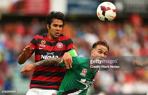 Nikolai Topor-Stanley of the Wanderers and Adam Taggart of the Jets contest possesson during the round 21 A-League match between the Western Sydney...